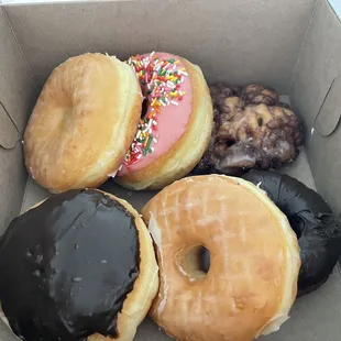 a variety of donuts in a box