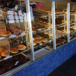 a display case filled with donuts