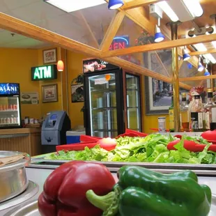 a counter with a variety of vegetables