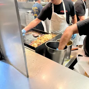 a group of people preparing food