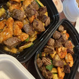 two takeout containers of food