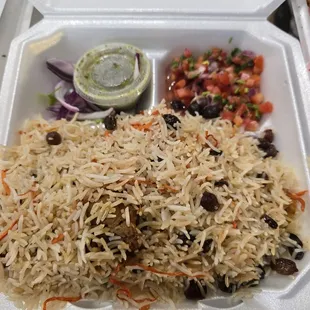 There's a huge lamb shank under all that rice