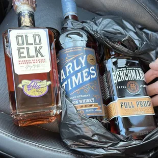 two bottles of alcohol in a car seat