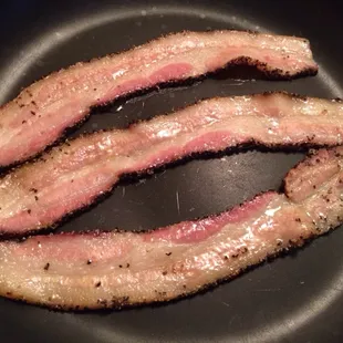 Marc &amp; Alison's Hickory Smoked Peppered Bacon frying up this morning.
