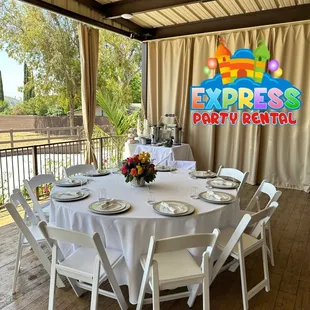 Round table set Resin Chairs , white Liner , Tables Set up , Center Pieces @expresspartyrental