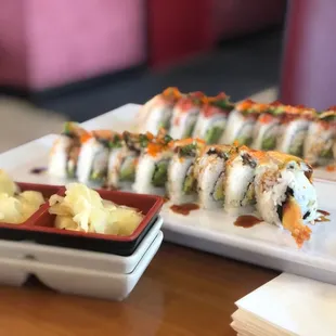 a sushi roll and a side dish