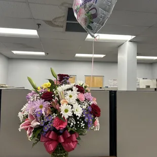 Mother&apos;s Day flowers (their large version/price point) and birthday balloon.