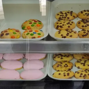 a variety of cookies in a display case