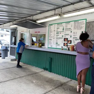 a man and a woman ordering food