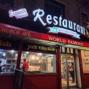 the front of a restaurant at night