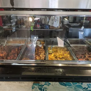 a variety of food in a display case