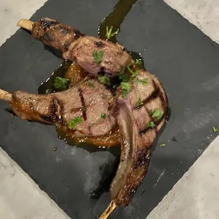 a piece of meat on a slate plate