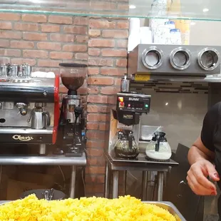 Mounds of rice and see the coffee pots of cafe y leche?