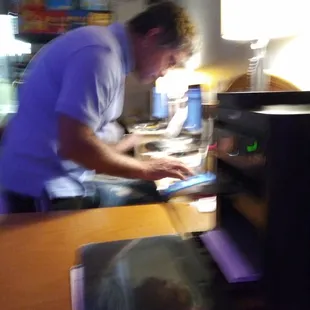 This is staff not wearing masks and operating through a window of a room. Very unprofessional.