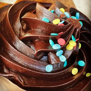a chocolate frosted cupcake with sprinkles
