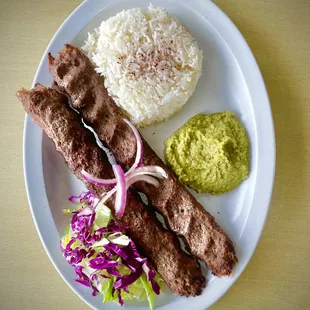 a plate of meat and rice