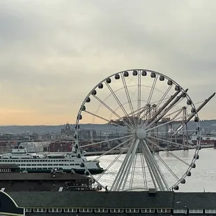 a ferris wheel on a cloudy day