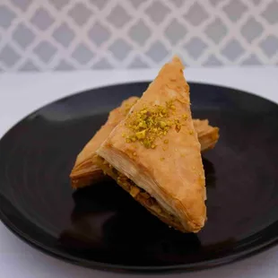 Baklava: Layers of thin, flaky pastry filled with chopped nuts and sweetened with honey syrup.