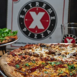 two pizzas on a table