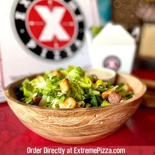 a salad in a wooden bowl