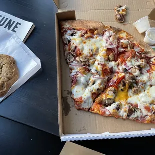 About $18.90 for two slices of the carnivore and a cookie. Wow.