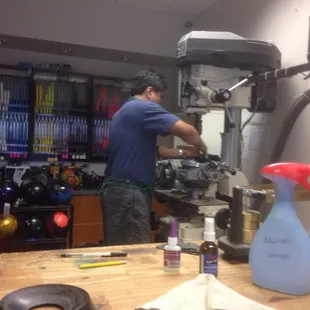 Ball programer drilling a customers ball.