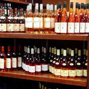 a shelf of wine bottles