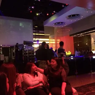 a group of people sitting in a bar