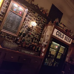 a cold beer fridge in a bar