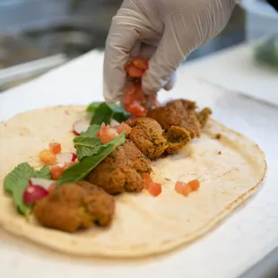 The making of our falafel wrap