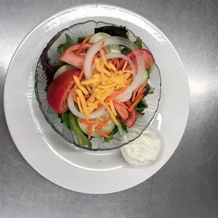 a bowl of salad with dressing