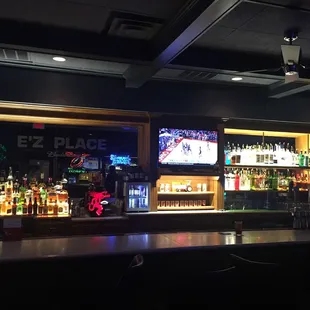 a bar with a lot of bottles