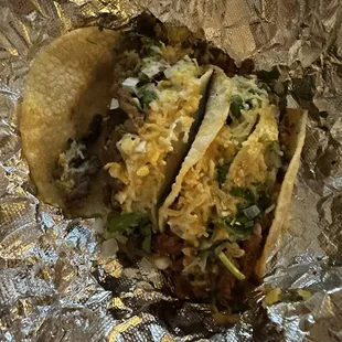 two tacos on a piece of tin foil