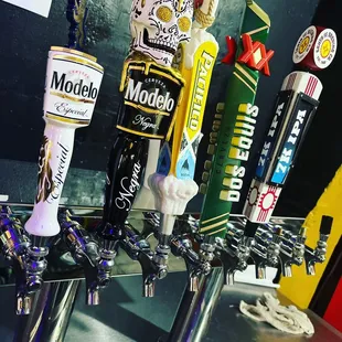 a row of beer taps
