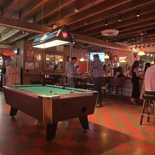 a pool table and bar