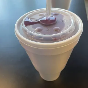 a smoothie in a plastic cup