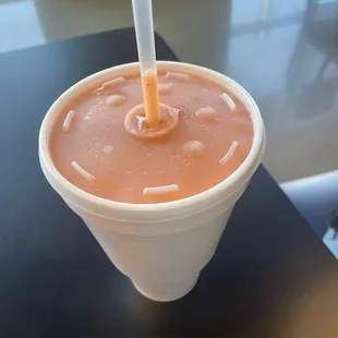 a drink in a plastic cup
