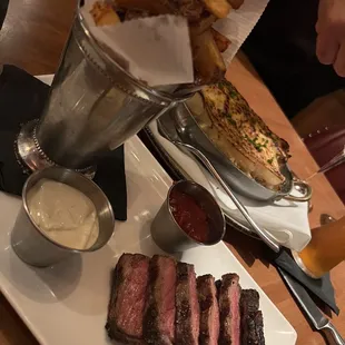 Steak frites (NY strip) and potatoes pave au gratin