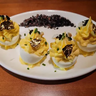 BLUE CRAB DEVILED EGGS Four cage free eggs, jumbo lump blue crab, caviar, gold leaf.