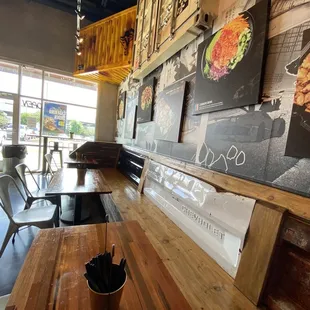 a wooden table and chairs in a restaurant