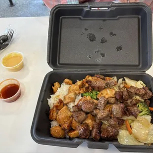 Hibachi steak and chicken, white rice, veggies.