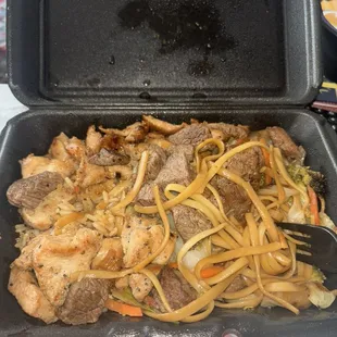 Steak and shrimp half rice half noodled