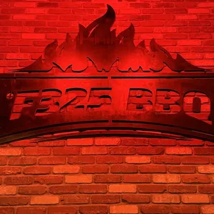 a sign on a brick wall