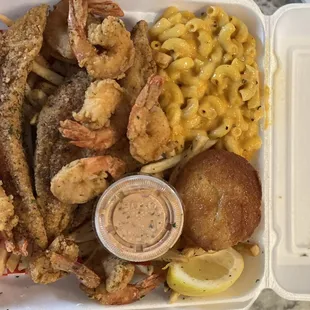 a tray of seafood and macaroni and cheese