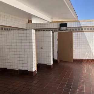 Men's restroom - half covered, half open air.