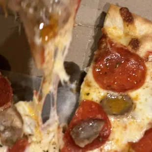 Pepperoni and sausage pizza. Look at that cheeeeese!