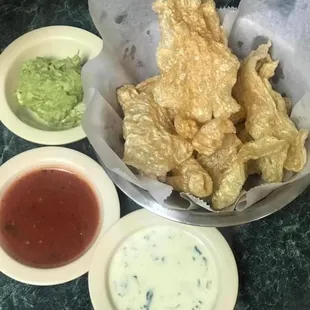 Fresh pork rinds, guac, queso, and salsa!