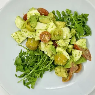 Signature Avocado, Mozzarella, Cherry Tomatoes in our HouseMade Arugula Dressing