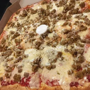 Sicilian style pizza with sausage and cheese