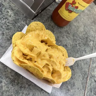 Nachos can add jalapeños and sour cream if wanted